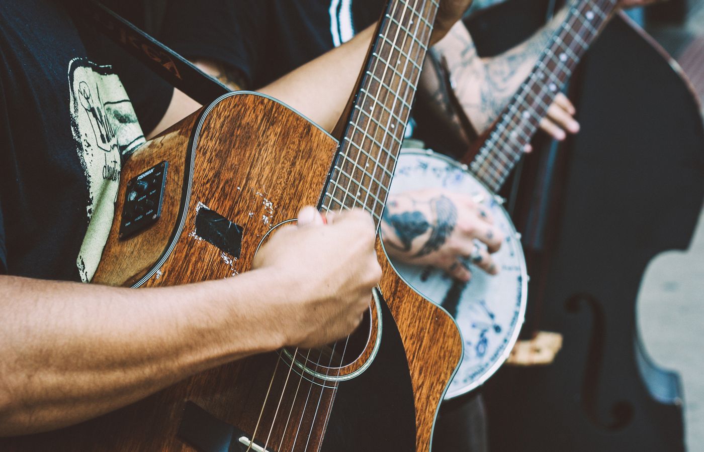 Musicians playing acoustic guitar and banjo bluegrass near Young Harris, Georgia